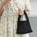 Hand-woven black cotton mesh handbag with a minimalist hollow-out design - Black