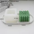 Detailed view of geometric cube silicone candle mold and finished green candle - No. 2 Magic Ball Silicone Mold