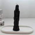 Minimalist black female figure candle standing on a white oval decorative ceramic tray - Female Body / Black