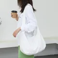 Minimalist white nylon crossbody bag for women featuring simple Korean leisure fashion style - White