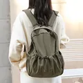 Retro green nylon drawstring backpack with unique pleated design and large capacity. - Green