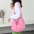 Lightweight pink nylon shoulder bag featuring a minimalist slouchy design for women - Rose Red