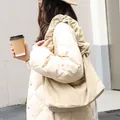 Fashionable cream corduroy shoulder bag featuring unique ruffled strap for casual style - Khaki