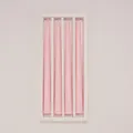 Detailed view of four pink taper candles neatly arranged in a minimalist white box - 4Pcs Set / Pink