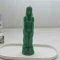 Handmade green female humanoid shaped decorative wax candle on a minimalist white tray - Female Body / Green