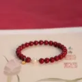 Traditional red cinnabar bead bracelet featuring a white pearl and gold Fu charm - Purple Gold Cinnabar Style / 15cm