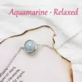 Minimalist silver chain bracelet featuring a round light blue aquamarine gemstone - Aquamarine Bracelet (White Gold Plated)