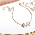 Elegant green rutilated quartz crystal bracelet with gold hollow Tree of Life charm - Hollow Tree Green Rutilated Quartz Bracelet