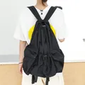 Minimalist Japanese style black nylon drawstring backpack with pleated slouchy design - Black