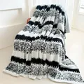 Soft black and white striped flannel throw blanket with a thick jacquard fleece texture - 100x150cm / Black