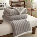 Cozy gray milk velvet plush blanket with white trim for office naps or home decor. - Coffee