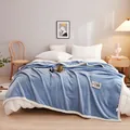Cozy blue milk velvet flannel blanket with decorative patch in bedroom lifestyle setting - Large Gift Box / Sky Blue