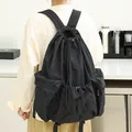 Stylish black wrinkled nylon drawstring backpack with side pockets for daily casual use - Black