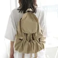 Casual khaki nylon drawstring backpack with large capacity and stylish pleated design. - Khaki
