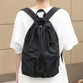 Fashionable black pleated nylon drawstring backpack for casual daily wear and school - Black