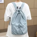 Casual light blue wrinkled nylon drawstring backpack featuring double front zipper pockets - Blue