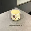 Cute cream-colored ceramic cup with bear and carousel illustrations, 350ml capacity. - Little Bear Paradise Mug / Mug (350ml)