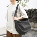 Large checkered canvas dumpling messenger bag with adjustable strap for women - Black