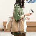 Casual canvas tote bag with drawstring closure and brown contrast straps - Brown