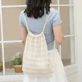 Stylish yellow and white striped knitted drawstring backpack with casual hollow-out design - Yellow