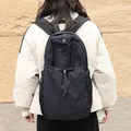 Japanese style minimalist black nylon drawstring backpack with large capacity for casual wear - Black