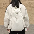 Minimalist beige nylon backpack with drawstring and carabiner for casual wear. - White