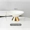 Modern 7-inch white ceramic ribbed fruit bowl with elegant gold base stand pedestal - 7" / White