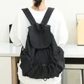 Minimalist black nylon drawstring backpack with unique pleated texture for daily use - Black