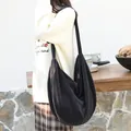 Large black corduroy hobo bag for women with casual dumpling shape and shoulder strap - Black