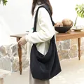 Black corduroy crossbody bag for women with knot strap detail and large capacity - Black