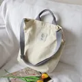 Minimalist cream canvas tote bag with grey shoulder straps and large storage capacity - White