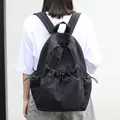 High-capacity casual Japanese style black drawstring nylon backpack with pleated design - Black