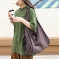 Large literary plaid canvas tote bag for women in stylish dark brown checkered finish - Coffee