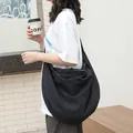 Large black bubble textured dumpling bag for women, stylish hobo crossbody style. - Dumpling Bag Style / Black