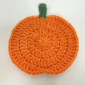 Handmade orange crochet pumpkin coaster for festive Halloween mug decoration - Orange (Green Stem)