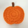 Handmade orange crochet pumpkin coaster for Halloween mug heat protection and decor - Orange