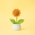 Handmade crochet sunflower mini potted plant with white ceramic pot on yellow backdrop - Mini Sunflower Potted