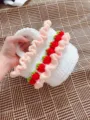 Handmade white crochet strawberry picnic basket bag featuring pink ruffled lace details - Finished Product / White