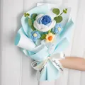 Handmade crochet flower bouquet featuring blue and white roses in light blue gift wrap - Gradient Blue Bouquet