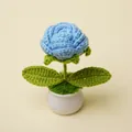 Hand-knitted blue crochet flower in a minimalist white ceramic pot for home decor - Light Blue Rose Potted Plant