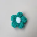 Handmade teal knitted wool flower accessory for brooches or hairpins with white center - Green Flower With White Center