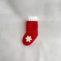 Handmade red crocheted Christmas stocking brooch with white snowflake decoration - Christmas Sock