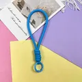 Detail of blue braided wrist lanyard with durable knotted design and circular clip - Phone Cord / 1 Piece / Blue