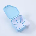 Blue portable denture bath storage box with removable strainer basket for cleaning - Blue