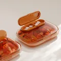 Tragbare orangefarbene durchsichtige Pillendose mit mehreren Fächern für Medikamente - 6 Gitter / Transparentes Rot