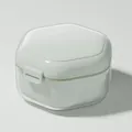 Portable hexagonal orthodontic retainer storage box in a clean white mint finish. - Green