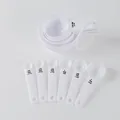 White 10-piece plastic measuring spoon and cup set with clear black scale markings - 10-Piece Set / White