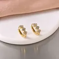 Close-up of gold-plated stainless steel flower hoop earrings with sparkling stones. - Rhinestone Clover Ear Clip / Gold