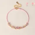 Elegant pink woven cord bracelet featuring sparkling crystal floral charms for women - Crystal Flower Hand Rope / Pink
