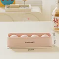 Pink 4-hole silicone ice ball mold with dimension markings for DIY home bar and kitchen use - Large 4-Ball Ice Mold / Pink